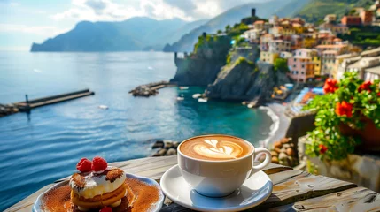 Fotobehang Coffee with Coastal Italian Village View . A cup of coffee topped with a raspberry, perfectly positioned on a balcony overlooking the colorful architecture of a coastal Italian village.  © phairot