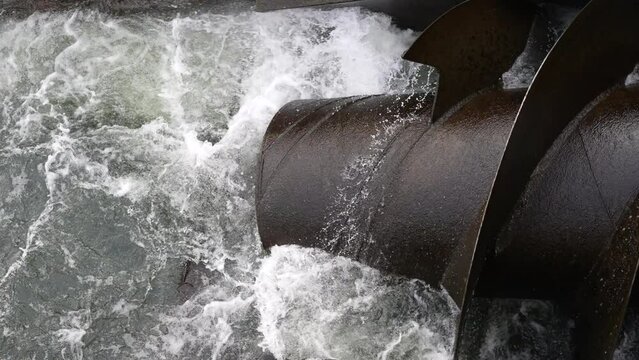 Hydrowater turbine screw making clean 
sustainable river energy electricity with hydroelectric