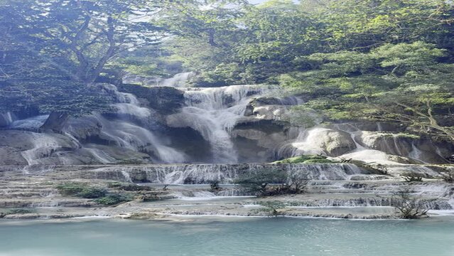 Kuang Si Waterfall, a famous waterfall of Luang Prabang, Laos. Beautiful waterfall with clear blue water.	