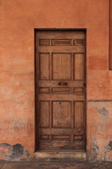 Fototapeta premium Wooden Door at the San Lorenzo in Lucina Church Portico in Rome, Italy
