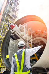 Engineer to working with the machine of technician control underground tunnel construction at...