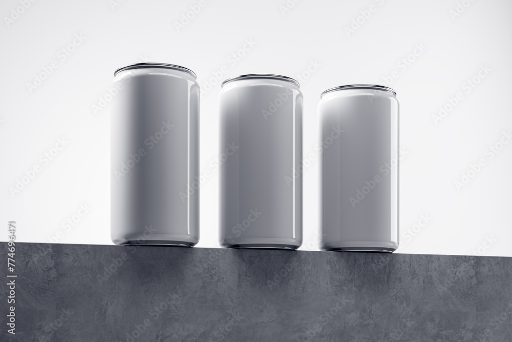 Poster Three empty white drink cans on light backdrop with mock up place. Beverage and food ad concept. 3D Rendering.