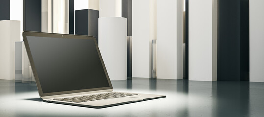 An open laptop in a minimalistic setting with geometric shapes, displayed on a light grey surface...