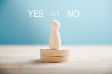 Wooden block exhibits people's decision-making between right and wrong considering yes or no. True...