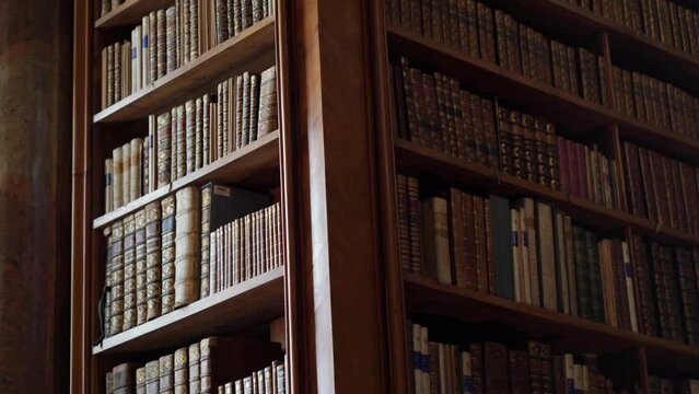 Austria. Vein. September 2023: Austrian State Library. State Hall or the Prunksaal. Osterreichische National bibliothek. We look at the books standing on the shelves in the ancient library.