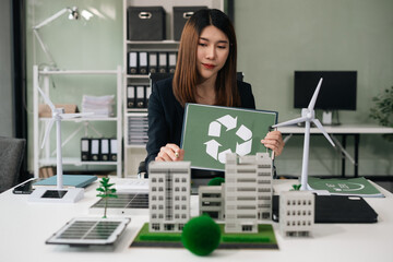 Business woman using computer on CO2 emission reduction concept with global warming . along with...