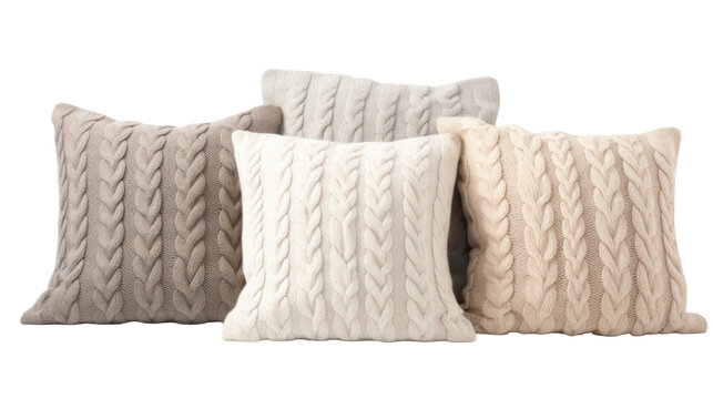 A quartet of fluffy pillows in assorted colors on a plain white background
