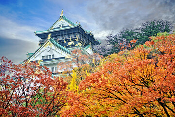 Osaka Castle and autumn leaves changing colors Important landmarks in Osaka Province, Japan.