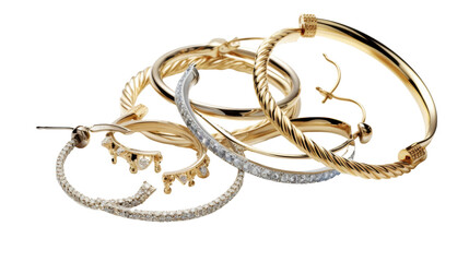 Various types of jewelry laid out on a white background, showcasing different styles and designs