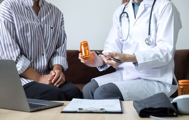 Female doctors who treat patients make an appointment to listen to the results after a physical...