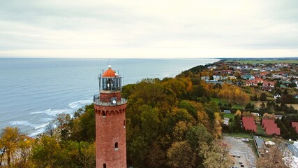 Captured by drone on a cloudy November day, the Gąski lighthouse stands against the somber sky. © Grzegorz