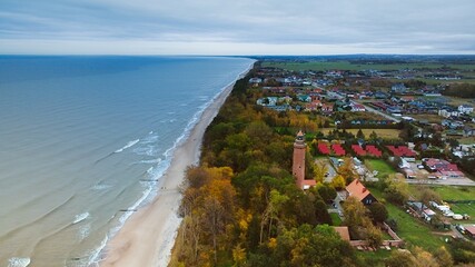 Captured by drone on a cloudy November day, the Gąski lighthouse stands against the somber sky.