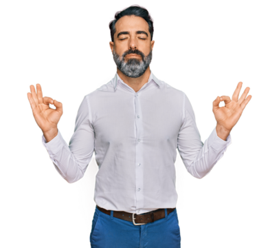 Middle aged man with beard wearing casual white shirt relax and smiling with eyes closed doing meditation gesture with fingers. yoga concept.