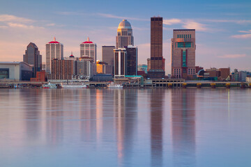 Louisville, Kentucky, USA. Cityscape image of Louisville, Kentucky, USA downtown skyline with reflection of the city the Ohio River at spring sunrise. - 774728684