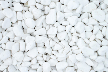 Pure texture of white pebbles. Small stones on the ground.
