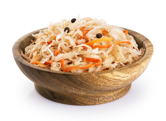 Sauerkraut with carrots and pepper in wooden bowl isolated on white background. With clipping path.