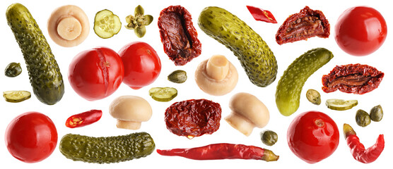 Pickled champignons, cucumbers, tomatoes, capers, chili pepper and sun dried tomatoes isolated on white background. Collection with clipping path.