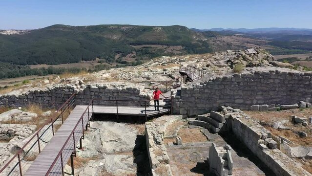 Retreating drone shot above the ancient city of Perperikon, a significant historical site located in the province of Kardzhali, in Bulgaria.