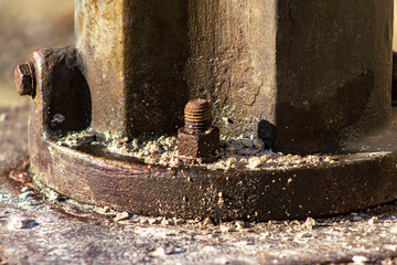 Detail of an old rusty screw. The screw holding the street light. Screw in outdoor use. Nut,...