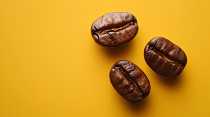 Coffee beans on a yellow background with copy space