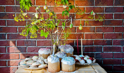 Good Friday. Hunting eggs. Easter composition on brick wall. Happy Easter holiday celebration at...