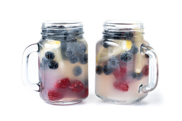 Fresh berry drink with blueberries and raspberries isolated on white background.