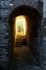 old rustic tunnel with warm light coming through