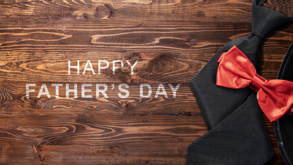 Black hat and red bow tie with a Happy Father's Day message