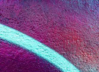 Colorful beautiful background of urban spray drawing graffiti on city wall. Bright vivid pattern of  modern art for wallpaper and design.