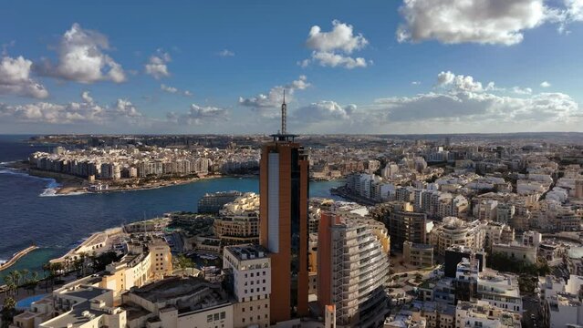 Aerial view of Portomaso Business Tower and St. Julians bay in the background. St. Julians City. Malta.