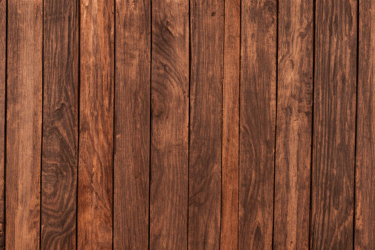 A rich mahogany wood plank texture that exudes warmth and natural elegance