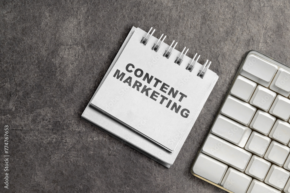 Poster keyboard and notebook with content marketing text
