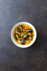Soup with mussels, shrimps and squid. Healthy eating. Seafood.