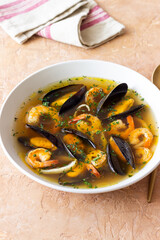 Soup with mussels, shrimps and squid. Healthy eating. Seafood.