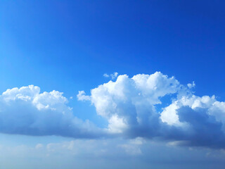 Naklejka na ściany i meble Bright blue sky clouds background in the daylight