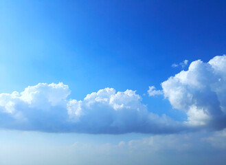Bright blue sky clouds background in the daylight