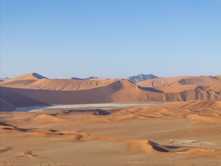 Fototapeta na wymiar Drone panorama over the Sossusvlei and the surrounding dunes of the Namib Desert in Namibia during the day