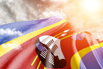 Eswatini national flag cloth fabric waving on beautiful cloudy Background.