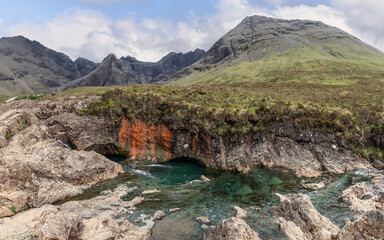 In the shadow of the Cuillin Hills, the Isle of Skye Fairy Pools beckon with their crisp waters and...