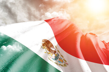 Mexico national flag cloth fabric waving on beautiful cloudy Background.