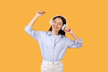 Woman showing joy while listening to music