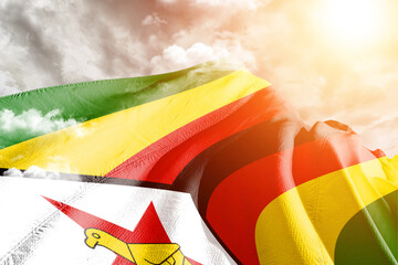 Zimbabwe national flag cloth fabric waving on beautiful cloudy Background.