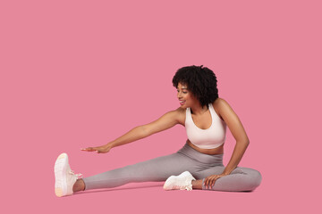 Fototapeta na wymiar Woman doing leg stretch exercise