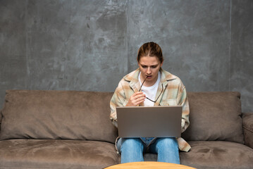 Side hustle money, second job concept. Young university student woman working freelance internet...