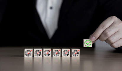 Checklist and target plan of organizational strategy and follow up on project success. wooden cube...