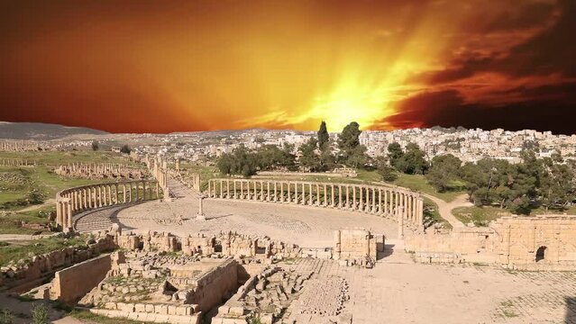 Forum (Oval Plaza) in Gerasa (Jerash), Jordan. Was built in the first century AD. Against the background of the sunset, 4K, time lapse, with zoom