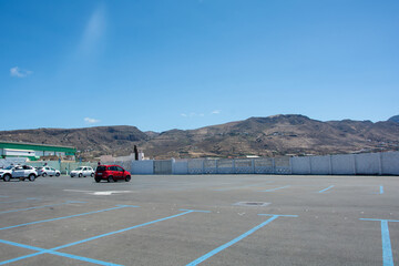 Large parking lot with a few cars in a city in Spain - 774811222
