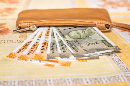 Women's purse with Indian rupees, Financial concept, India money, The highest denominations of 200 and 500 rupees