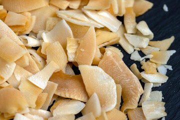 sweet orange and yellow coconut flakes fried in sugar