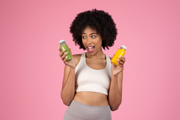 Woman delighted with green and yellow juices